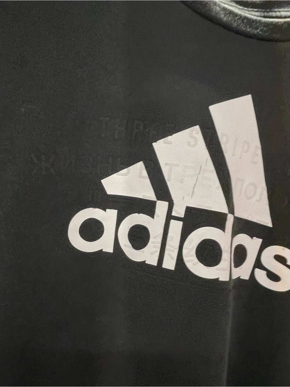black Adidas crewneck fleece sweatshirt featuring a large white performance